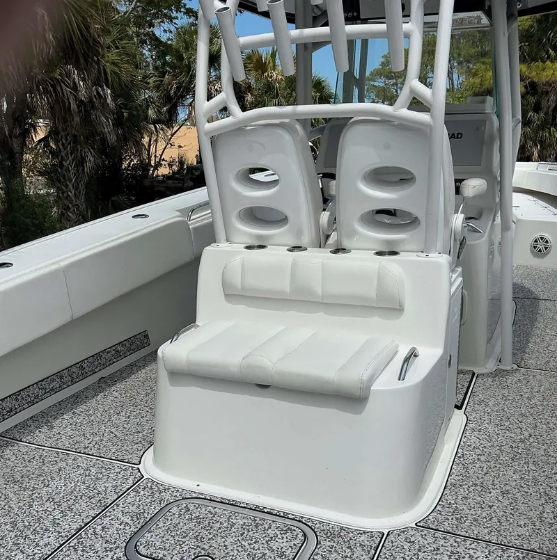 Slide: The Image of 2017 Cape Horn 36 XS boat interior with white seating and rod holders. - 19