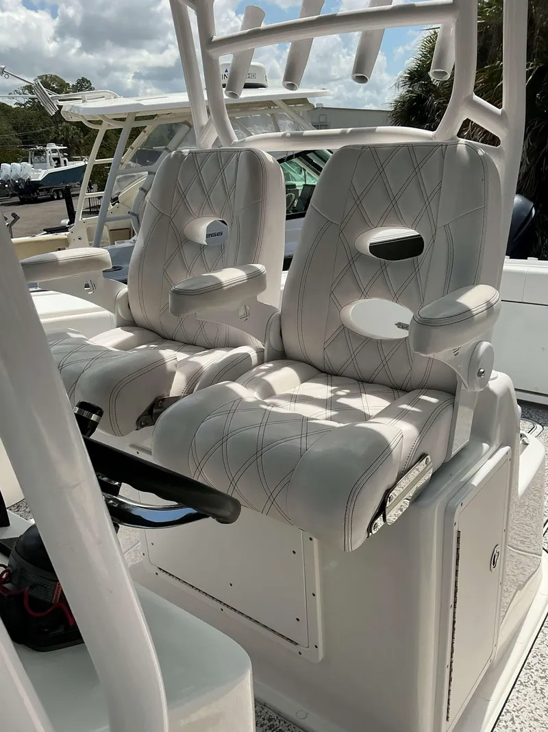 Slide: The Image of 2017 Cape Horn 36 XS boat seats with white upholstery and armrests. - 22