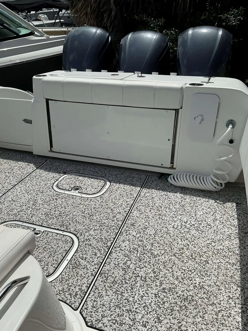 Slide: The Image of 2017 Cape Horn 36 XS boat deck with triple engines and coiled hose. - 23