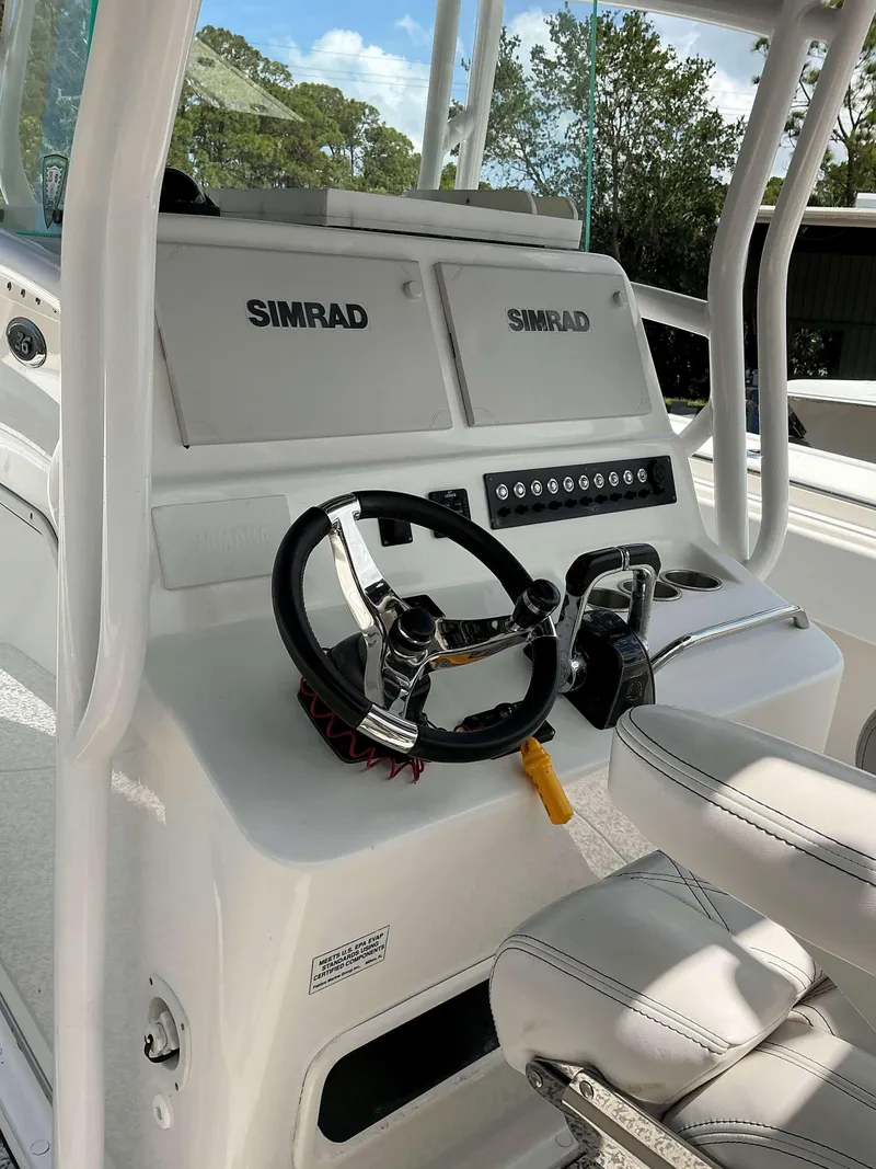 Slide: The Image of 2017 Cape Horn 36 XS boat console with dual Simrad displays and steering wheel. - 3