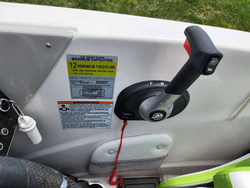 Slide: The Image of Control panel of 2023 Starcraft SVX 191 OB boat with capacity warning label. - 12