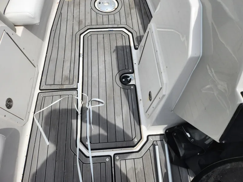 Slide: The Image of 2023 Starcraft SVX 191 OB boat deck with gray flooring and white accents. - 13