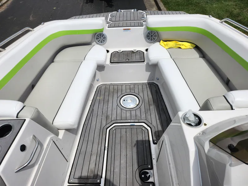 Slide: The Image of 2023 Starcraft SVX 191 OB boat interior with gray seating and green accents. - 14