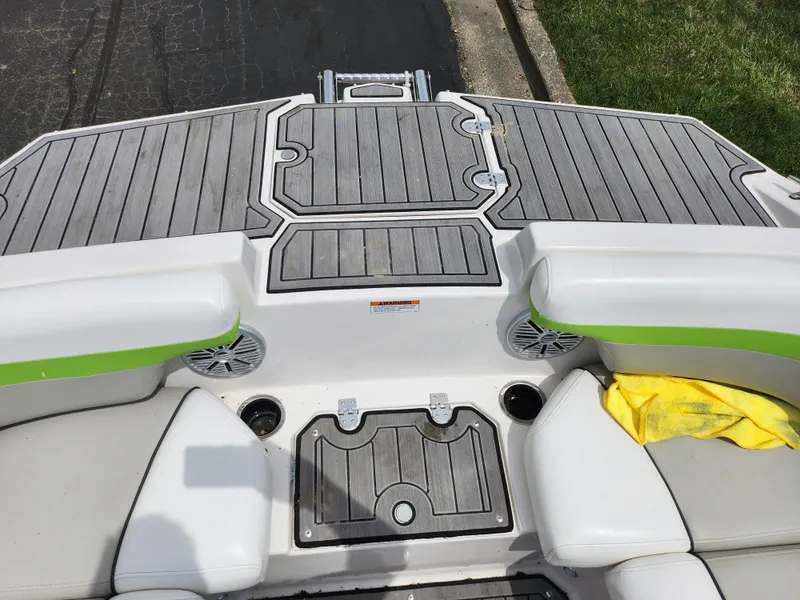 Slide: The Image of 2023 Starcraft SVX 191 OB boat interior with gray decking and white seating. - 15