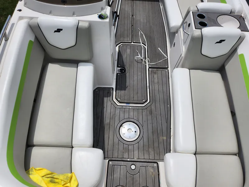 Slide: The Image of 2023 Starcraft SVX 191 OB boat interior with white seating and gray flooring. - 16
