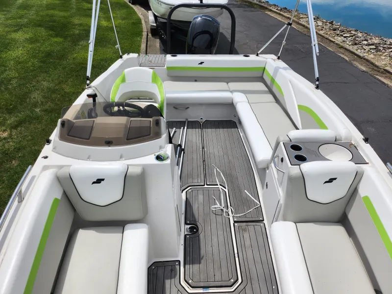 Slide: The Image of 2023 Starcraft SVX 191 OB boat interior with seating and steering console. - 17