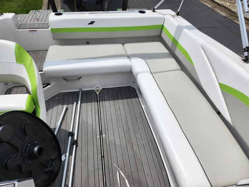Slide: The Image of 2023 Starcraft SVX 191 OB boat interior with gray and green seating and deck. - 19
