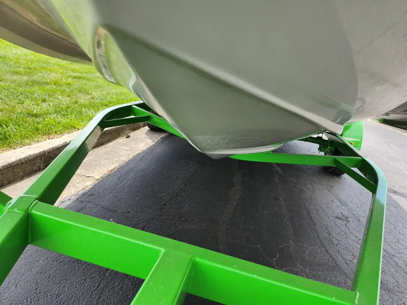 Slide: The Image of 2023 Starcraft SVX 191 OB boat on a vibrant green trailer. - 7