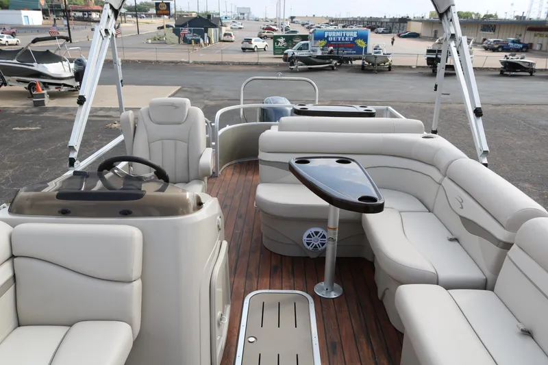 Slide: The Image of 2015 Bennington 22SSLDX pontoon boat with spacious seating and sleek interior design. - 10