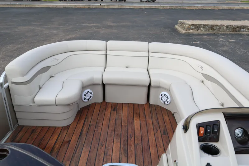 Slide: The Image of 2015 Bennington 22SSLDX pontoon boat with spacious seating and wooden deck. - 12