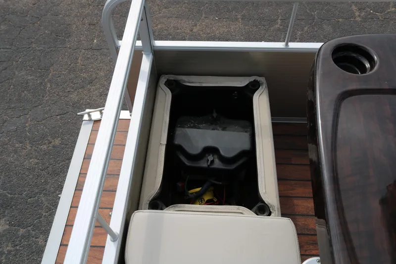 Slide: The Image of 2015 Bennington 22SSLDX pontoon boat interior with storage compartment. - 33