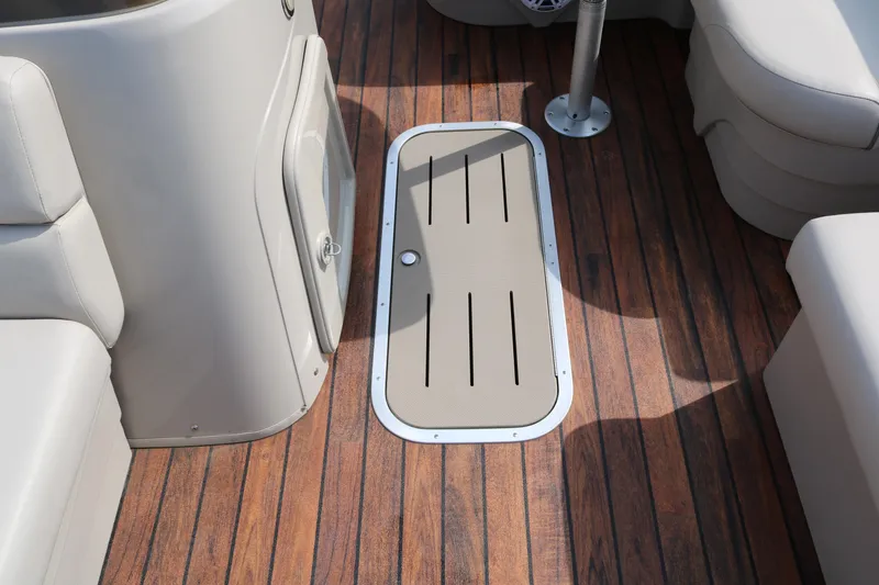Slide: The Image of 2015 Bennington 22SSLDX boat interior with wood flooring and seating. - 36