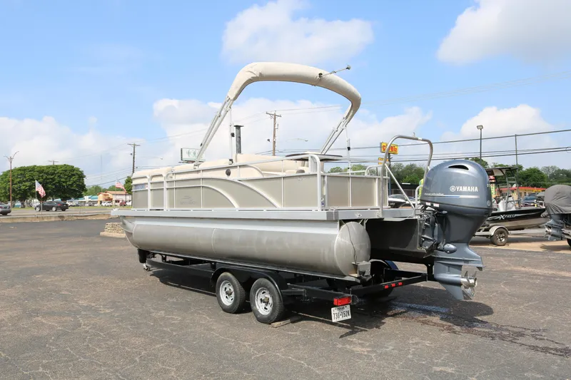 Slide: The Image of 2015 Bennington 22SSLDX pontoon boat on trailer with Yamaha outboard motor. - 5