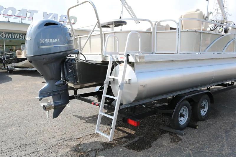 Slide: The Image of 2015 Bennington 22SSLDX pontoon boat with Yamaha outboard motor on trailer. - 9