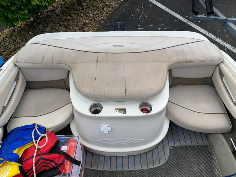 Slide: The Image of 2001 Maxum 1800 SR boat interior with beige seating and cup holders. - 7