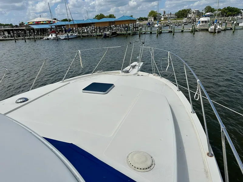 Slide: The Image of 1986 Chris-Craft Yacht Fisherman docked at marina, view from bow deck. - 10