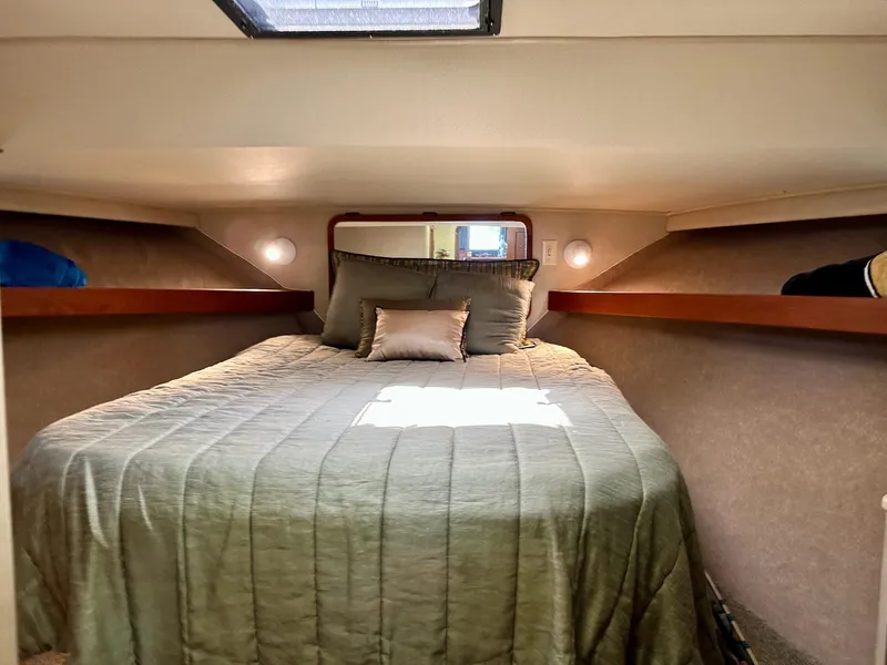 Slide: The Image of Cozy cabin interior of 1986 Chris-Craft Yacht Fisherman with bed and soft lighting. - 30