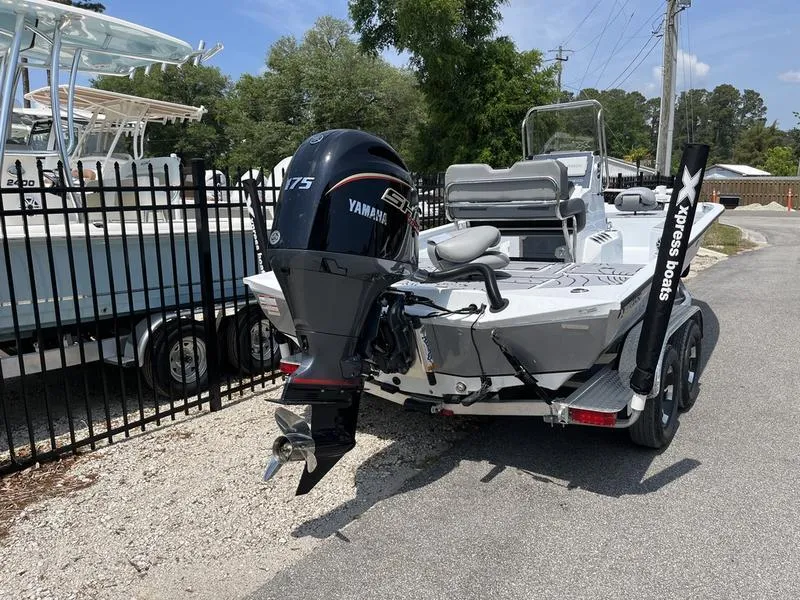 Slide: The Image of 2025 Xpress H22B boat with Yamaha 175 engine on trailer, parked outdoors. - 3