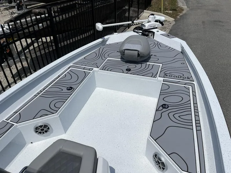 Slide: The Image of 2025 Xpress H22B boat deck with custom SeaDek flooring, featuring sleek design and modern amenities. - 4