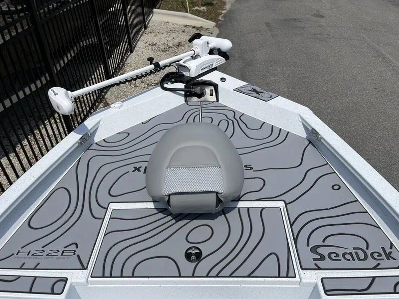 Slide: The Image of 2025 Xpress H22B boat deck with SeaDek flooring and trolling motor. - 5