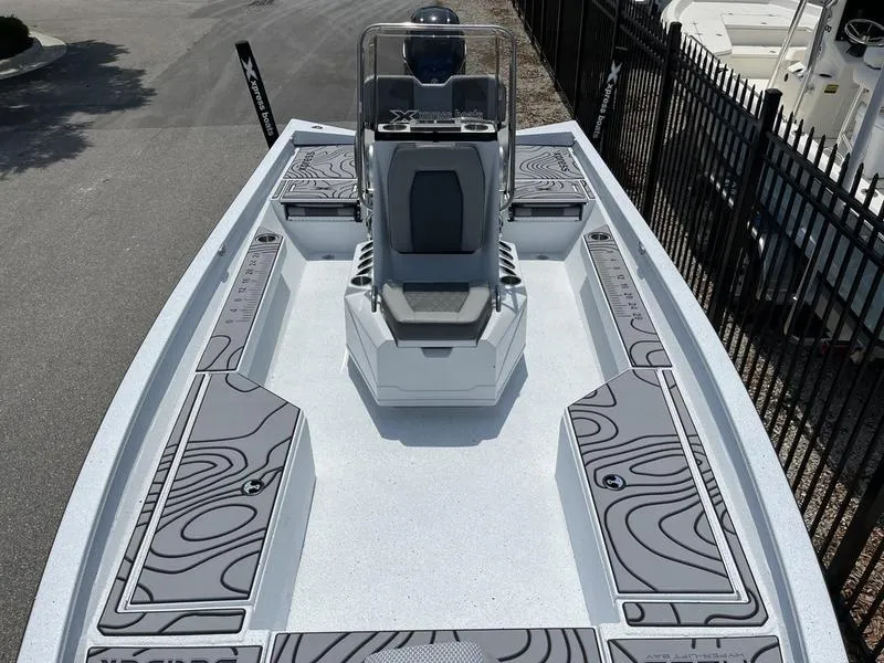 Slide: The Image of 2025 Xpress H22B boat with sleek design and modern seating, viewed from above. - 7