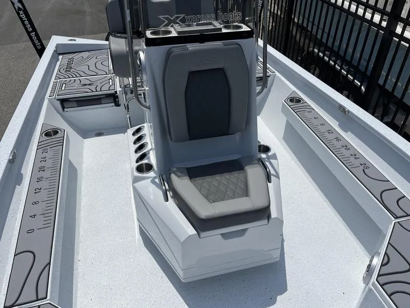 Slide: The Image of 2025 Xpress H22B boat interior with seating and measurement guides. - 8