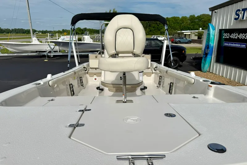 Slide: The Image of 2024 Carolina Skiff 19 LS boat interior with seating and storage compartments. - 10