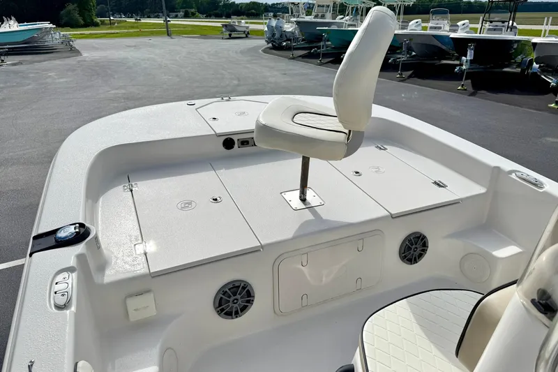 Slide: The Image of 2024 Carolina Skiff 19 LS boat deck with seating and storage compartments. - 11