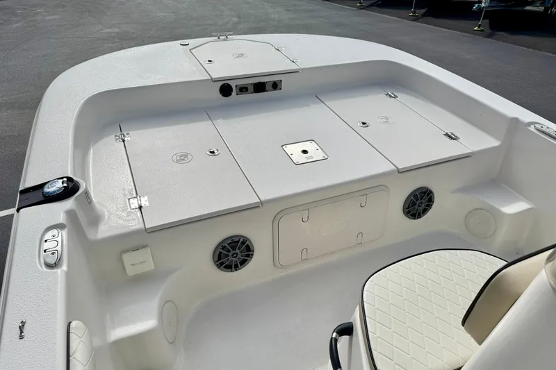 Slide: The Image of 2024 Carolina Skiff 19 LS boat interior with storage compartments and seating. - 12