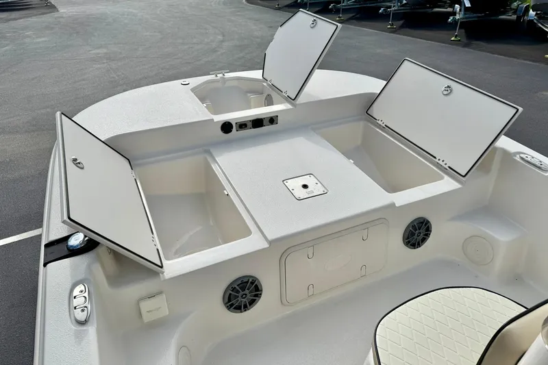 Slide: The Image of 2024 Carolina Skiff 19 LS boat interior with open storage compartments. - 13