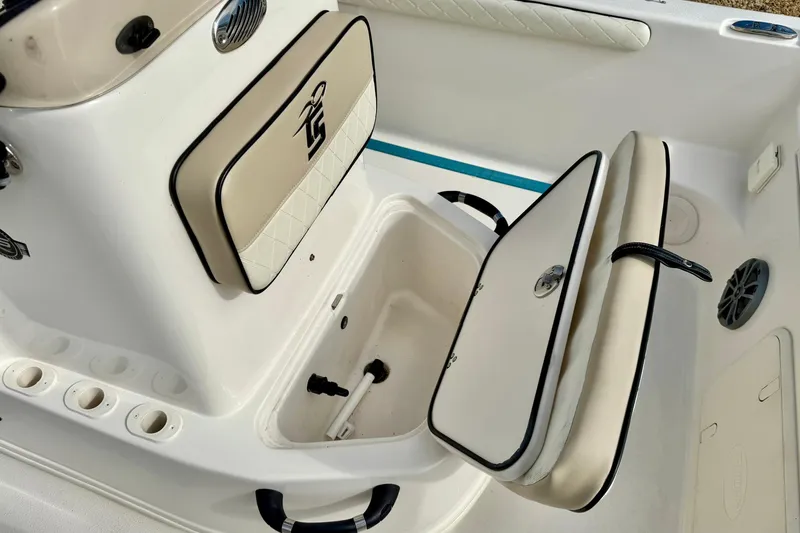Slide: The Image of 2024 Carolina Skiff 19 LS boat interior with storage compartments open. - 18