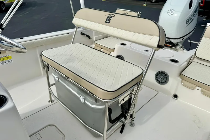 Slide: The Image of 2024 Carolina Skiff 19 LS boat interior with cushioned seating and storage. - 23