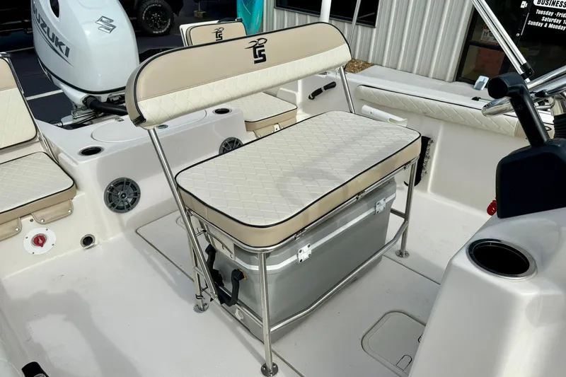 Slide: The Image of 2024 Carolina Skiff 19 LS boat interior with cushioned seating and storage. - 24