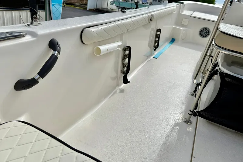 Slide: The Image of 2024 Carolina Skiff 19 LS boat interior with seating and storage features. - 28