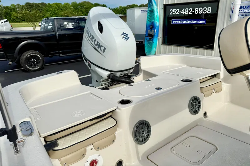 Slide: The Image of 2024 Carolina Skiff 19 LS boat with Suzuki outboard motor, featuring spacious seating and storage. - 29