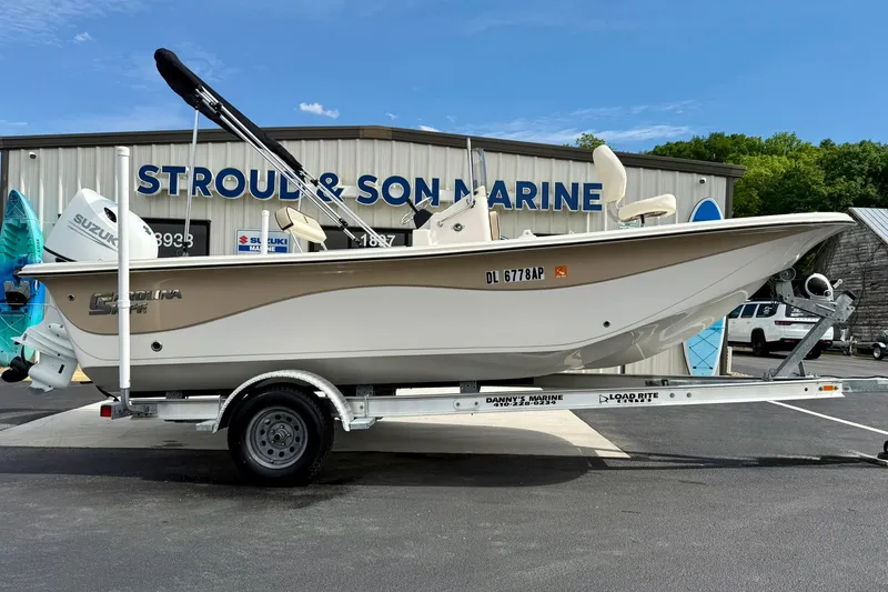 Slide: The Image of 2024 Carolina Skiff 19 LS boat on trailer at Stroud & Son Marine dealership. - 6