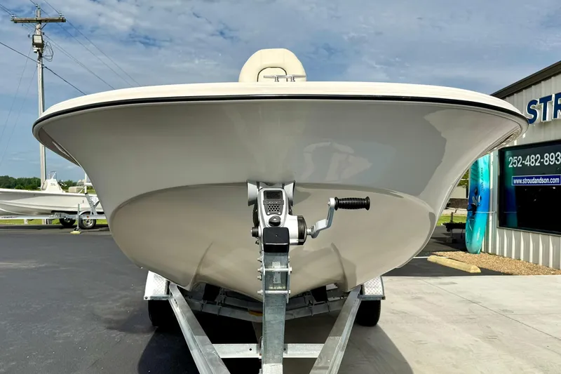 Slide: The Image of 2024 Carolina Skiff 19 LS boat on trailer, front view, outdoors. - 8