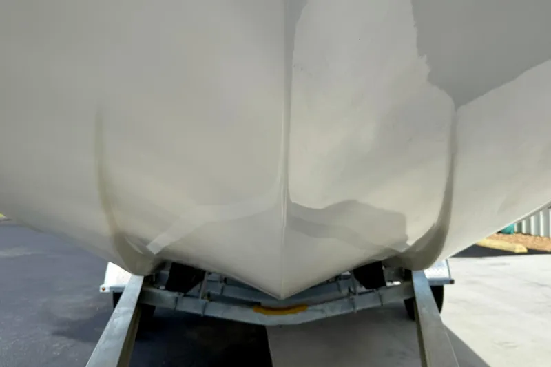 Slide: The Image of 2024 Carolina Skiff 19 LS boat hull on trailer, close-up view. - 9