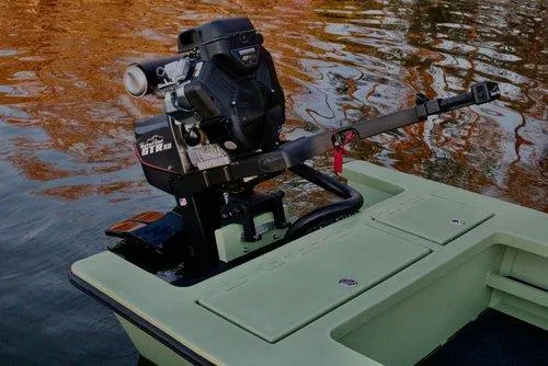 Slide: The Image of Sawgrass 17 boat (2025) with powerful outboard motor on calm water. - 12