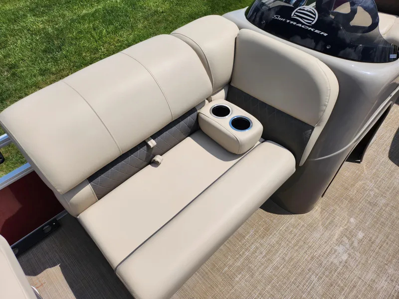 Slide: The Image of 2021 Sun Tracker Fishin' Barge 20 DLX boat seating with cup holders, beige upholstery. - 13