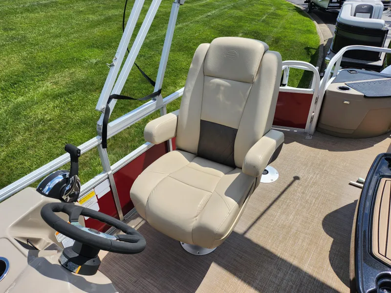 Slide: The Image of 2021 Sun Tracker Fishin' Barge 20 DLX captain's chair and steering wheel on deck. - 16