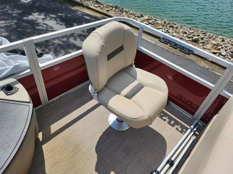 Slide: The Image of 2021 Sun Tracker Fishin' Barge 20 DLX boat seat, beige upholstery, near water. - 19