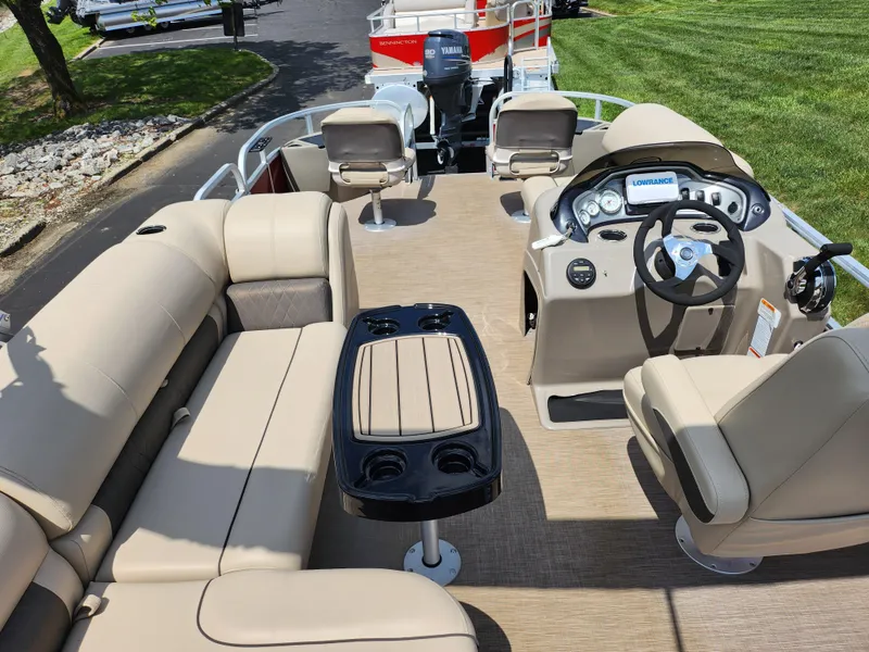 Slide: The Image of 2021 Sun Tracker Fishin' Barge 20 DLX interior with seating and steering console. - 23