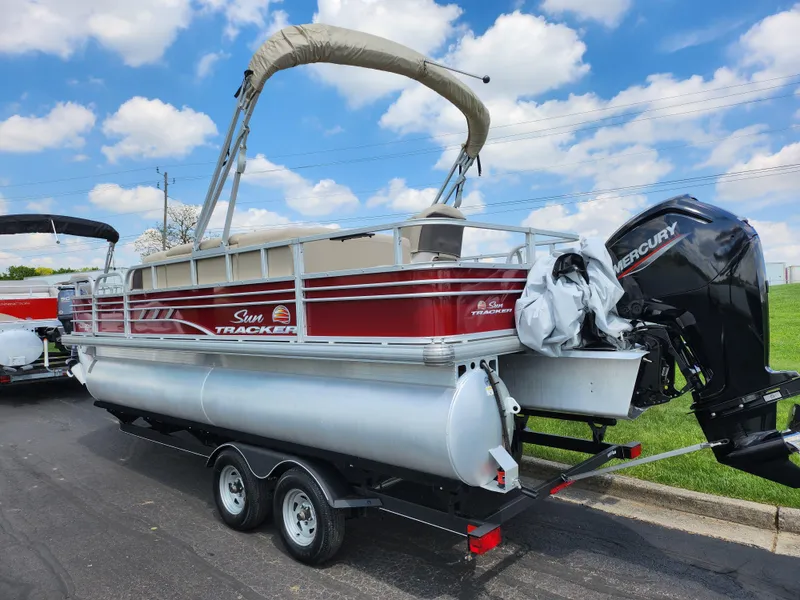 Slide: The Image of 2021 Sun Tracker Fishin' Barge 20 DLX pontoon boat with Mercury outboard motor. - 3