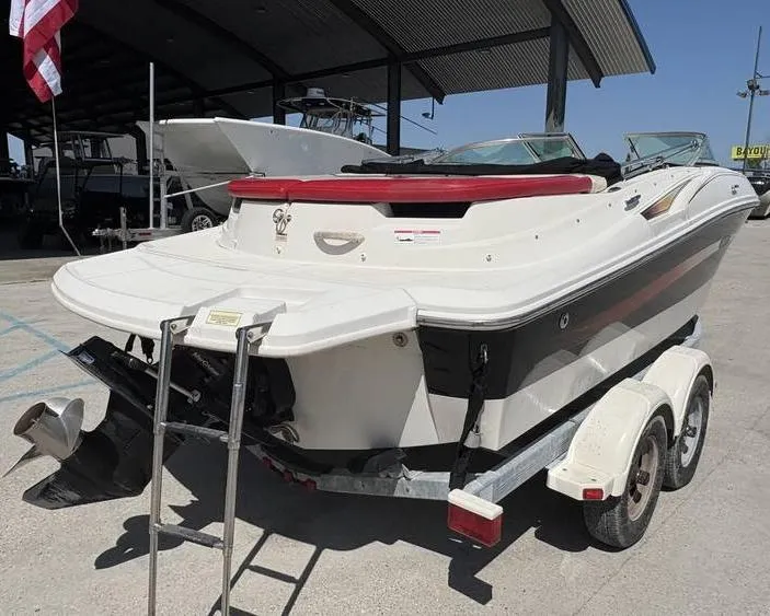 Slide: The Image of 2007 Sea Ray 195 Sport boat on trailer, rear view, parked outdoors. - 3