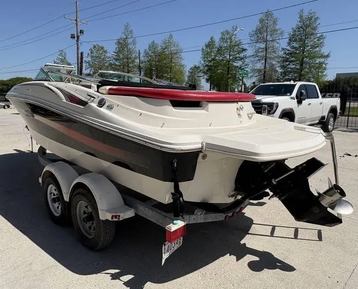 Slide: The Image of 2007 Sea Ray 195 Sport boat on trailer, parked outdoors. - 4