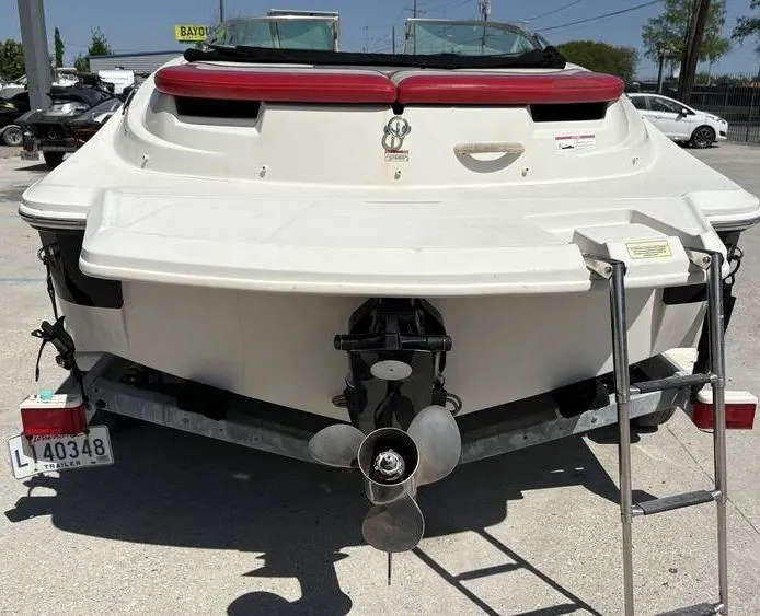 Slide: The Image of 2007 Sea Ray 195 Sport boat on trailer, rear view with propeller and ladder. - 5