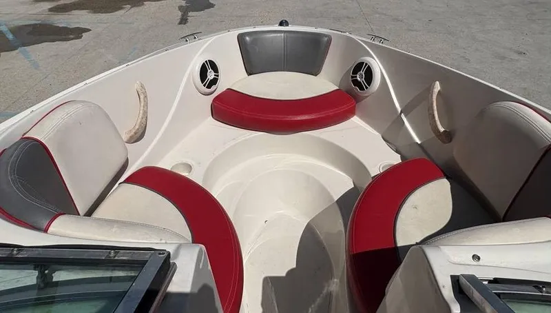Slide: The Image of 2007 Sea Ray 195 Sport boat interior with red and gray seating. - 8