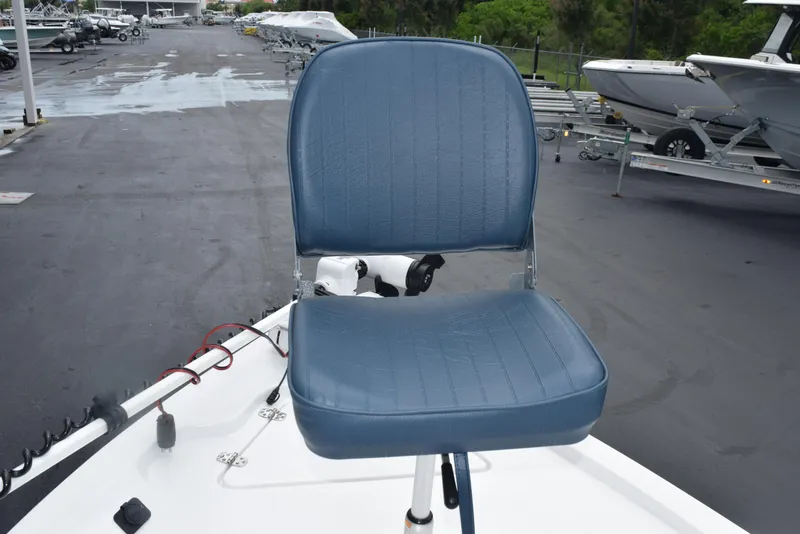 Slide: The Image of Blue seat on 2017 Blazer Bay 2200 boat deck, parked in marina. - 14