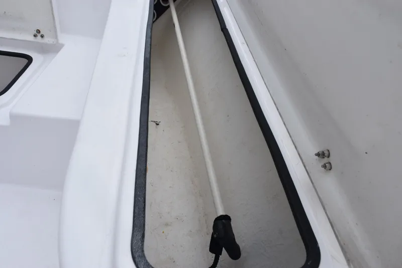 Slide: The Image of Storage compartment of 2017 Blazer Bay 2200 boat, featuring a white interior. - 17